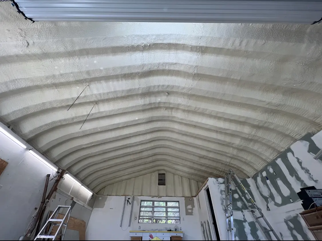 Spray polyurethane foam applied to the underside of a metal roof deck in Grandview Heights